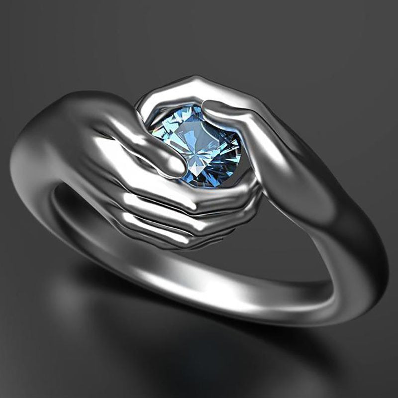 Silver-Plated Holding Hand Blue Crystal Ring image 0